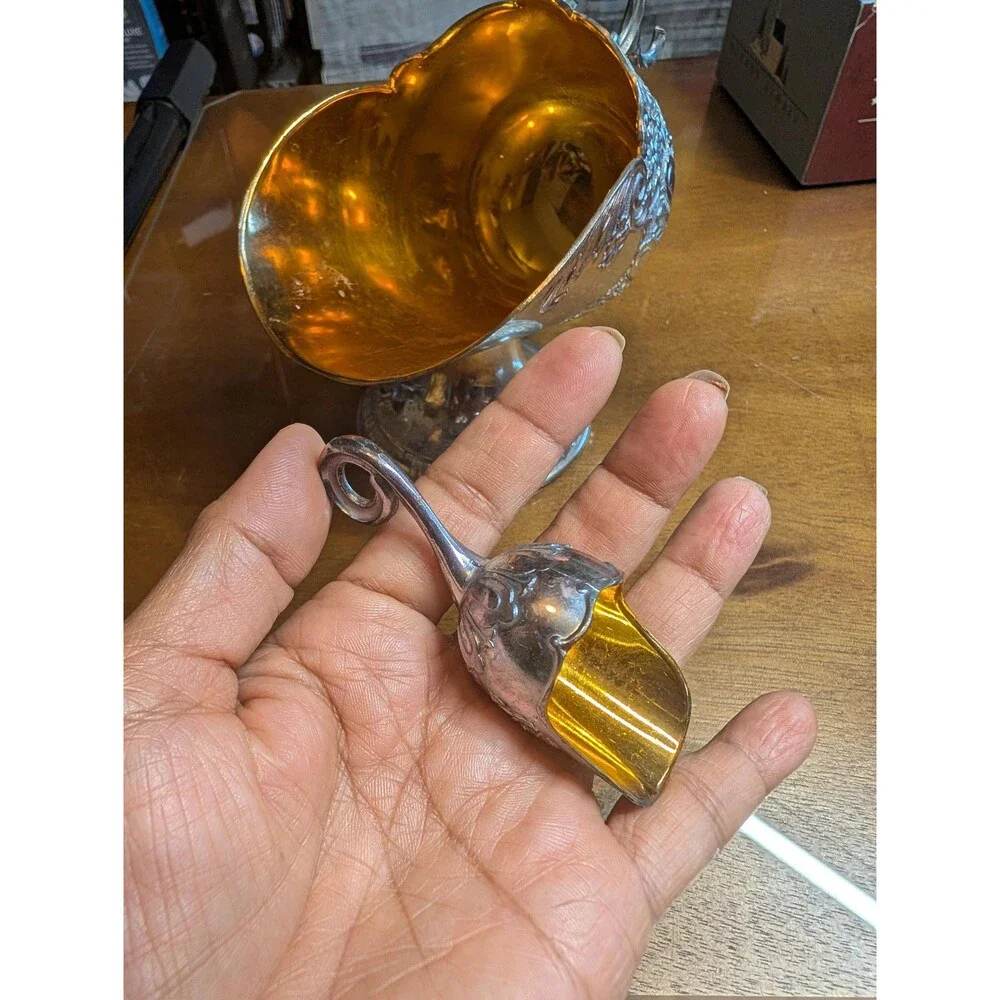 vintage silver-plated sugar scuttle with a matching mini scoop